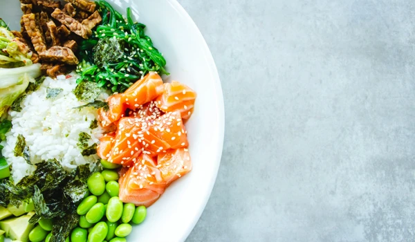Bowl With A Healthy Dinner Of Salmon, Rice And Vegetables