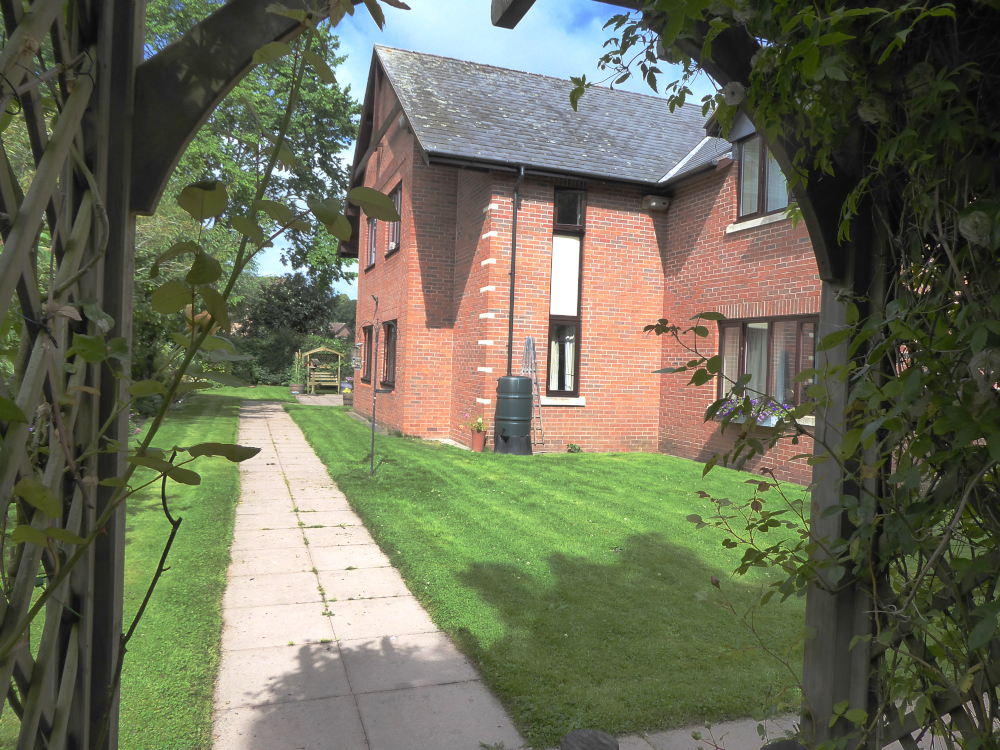 Lawns at the side of Abbeyfield House, Bishops Castle SY9 5PA