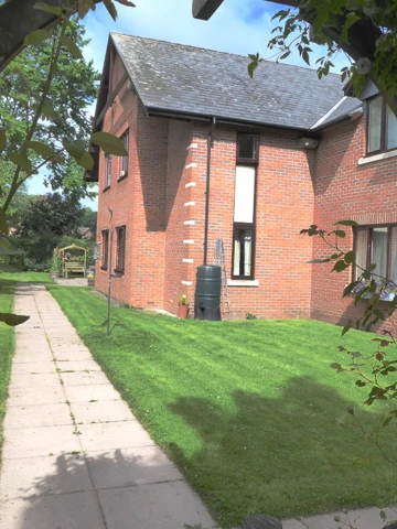 Lawns at the side of Abbeyfield House, Bishops Castle SY9 5PA