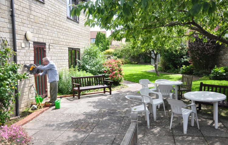 resident-in-the-sunny-garden-at-abbeyfield-house Abbeyfield House, Chipping Sodbury BS37 6LB
