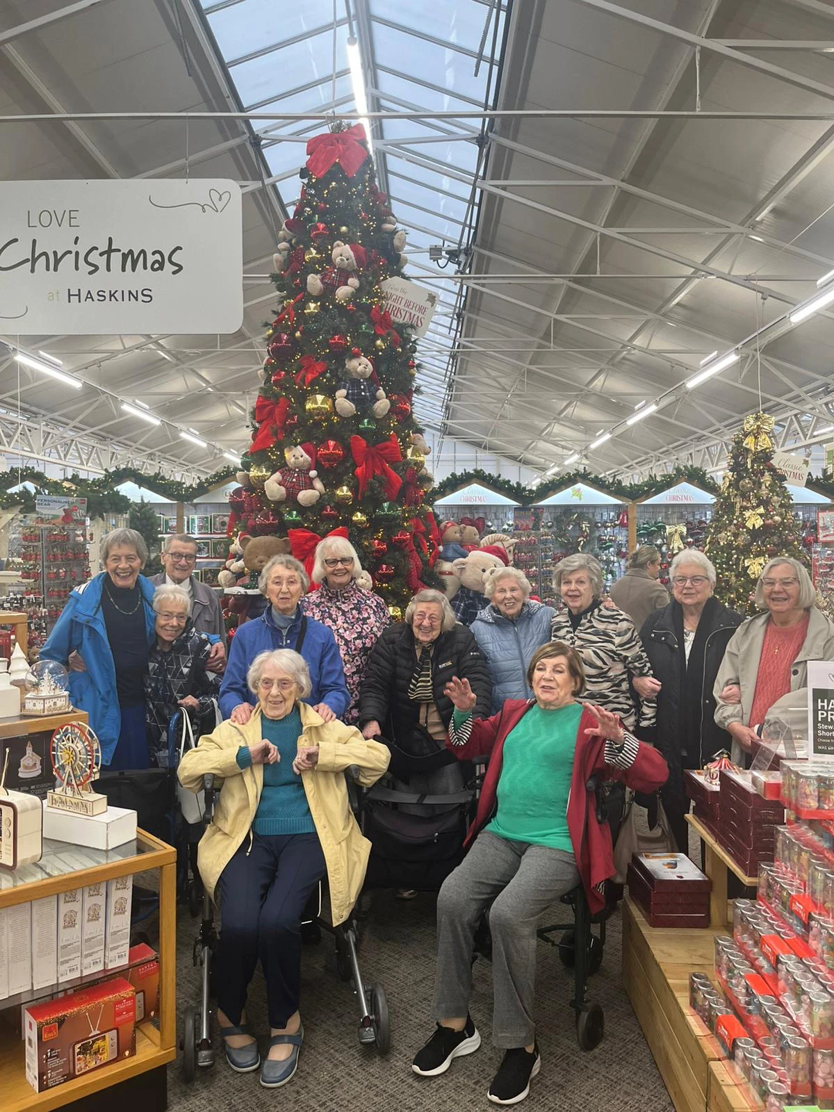 Residents in front of Xmas tree