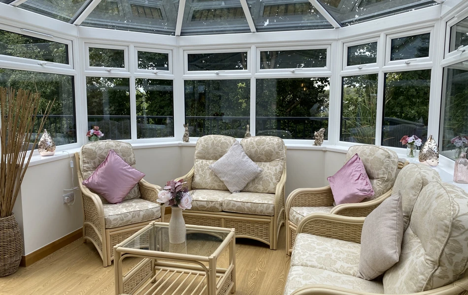 Westbourne House with conservatory furniture and view of the garden at Westbourne House