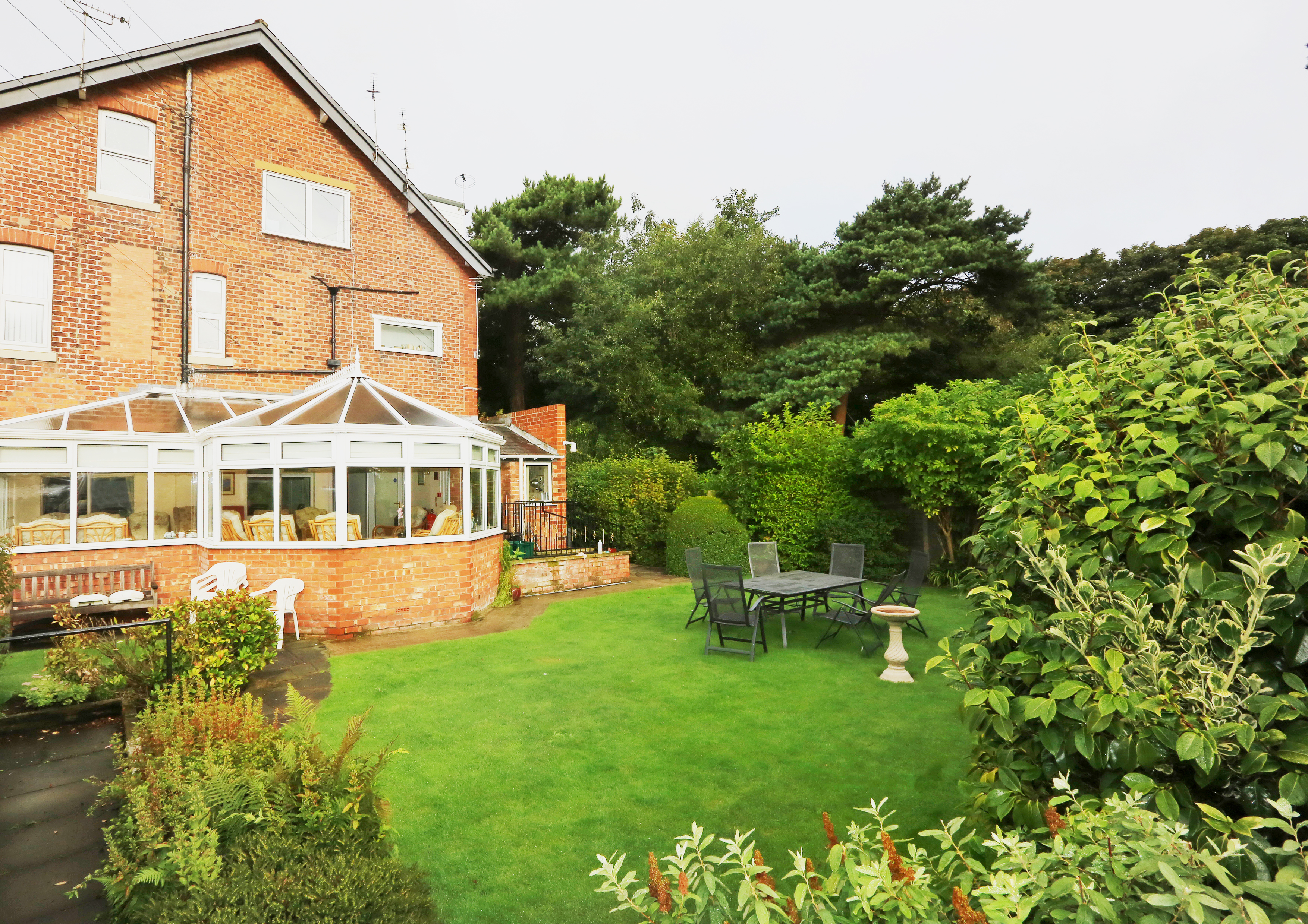 Rear garden and conservatory at Abbeyfield House, Lytham St Annes FY8 5NN