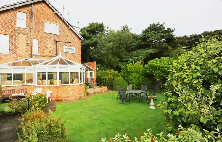 Rear garden and conservatory at Abbeyfield House, Lytham St Annes FY8 5NN