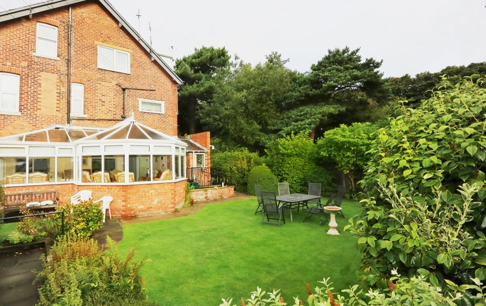 Rear garden and conservatory at Abbeyfield House, Lytham St Annes FY8 5NN