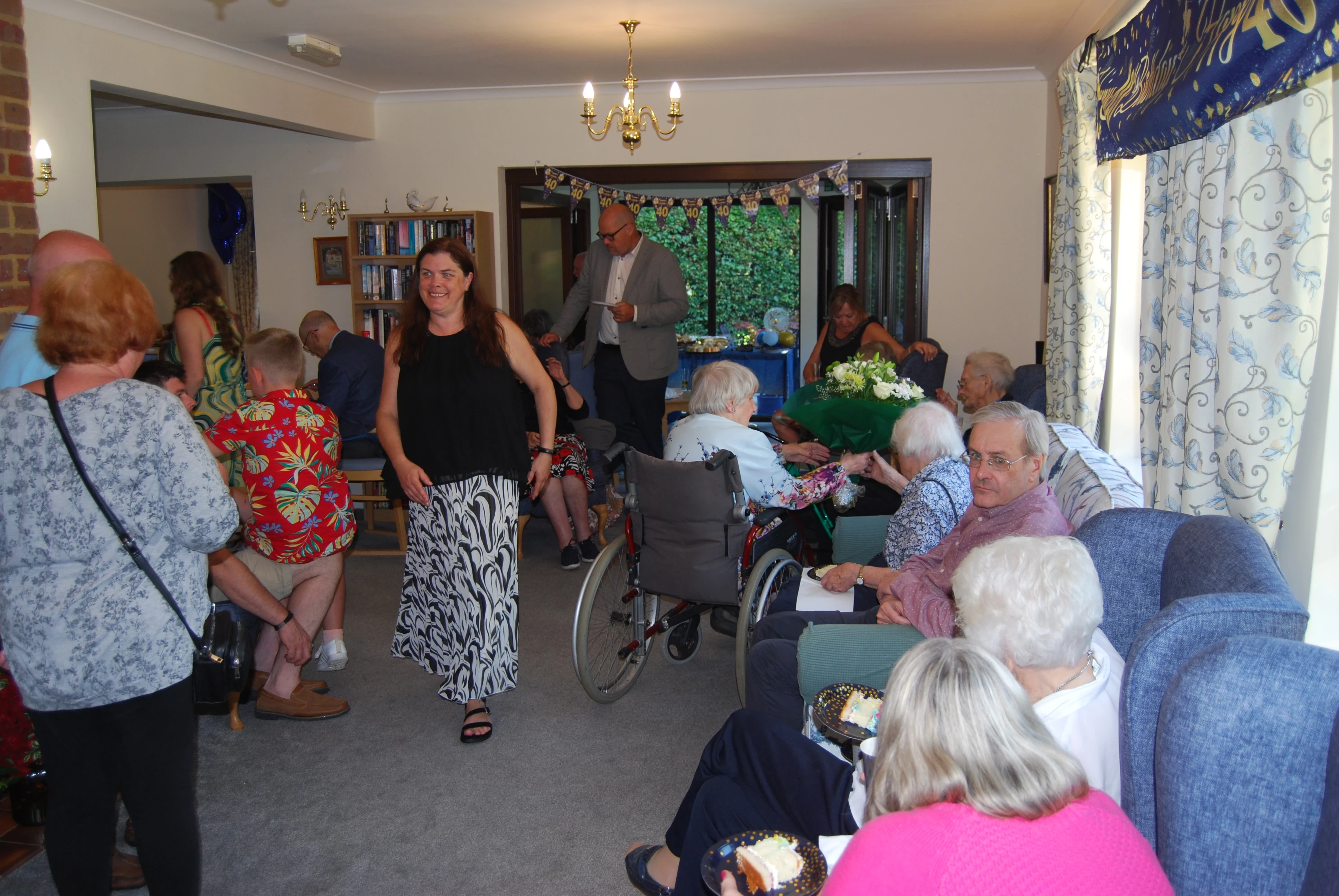 A group of people in a living room having a party