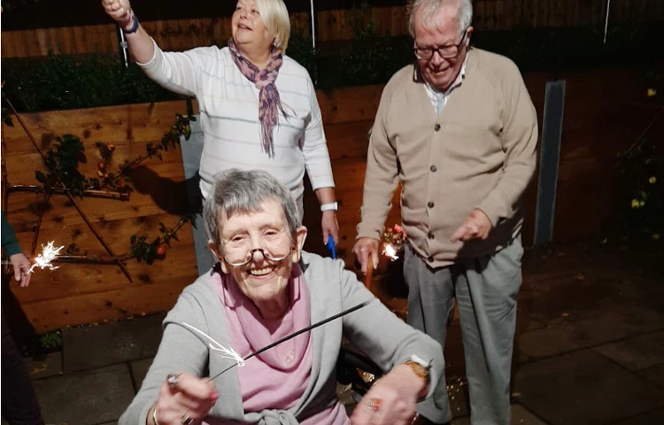 Residents Enjoying Celebrating Bonfire Night At Harleston House