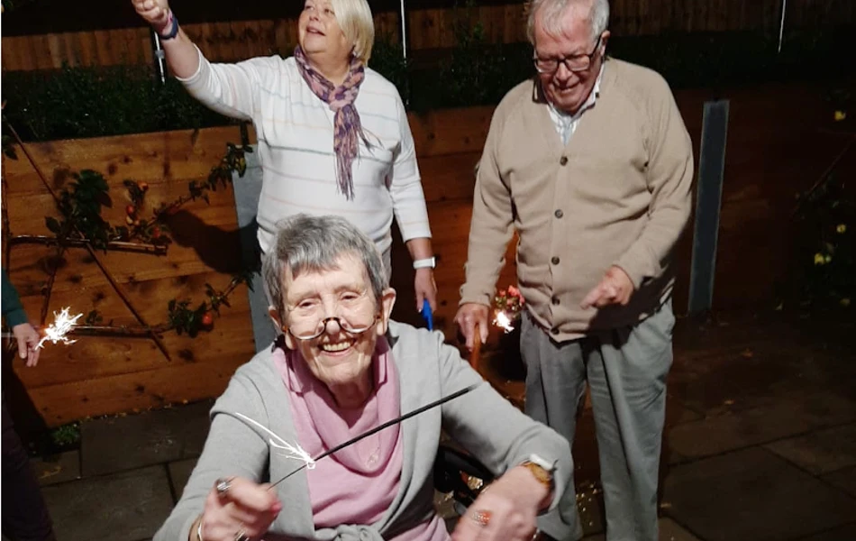 Residents Enjoying Celebrating Bonfire Night At Harleston House