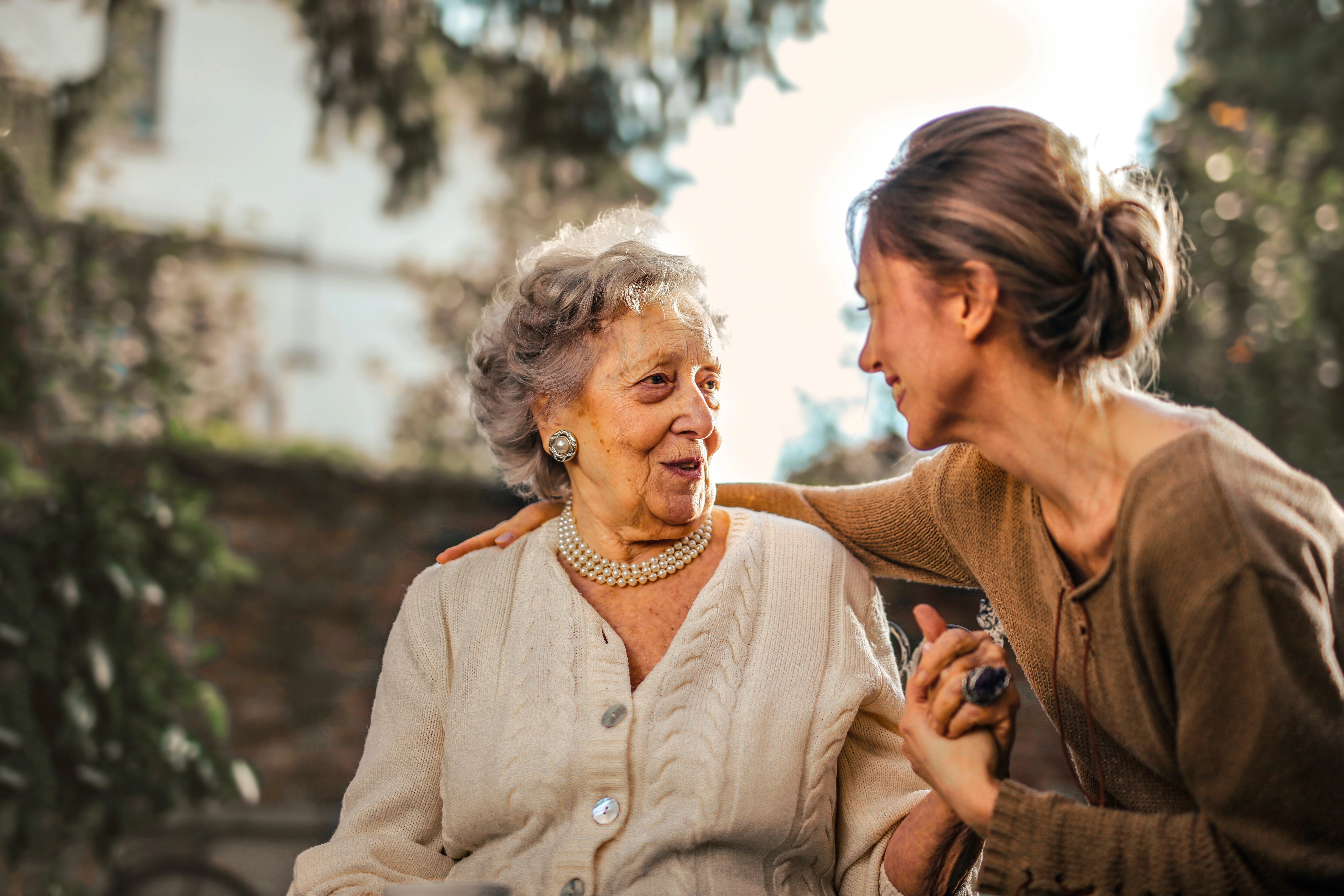Younger Woman With Arm Around Older Woman