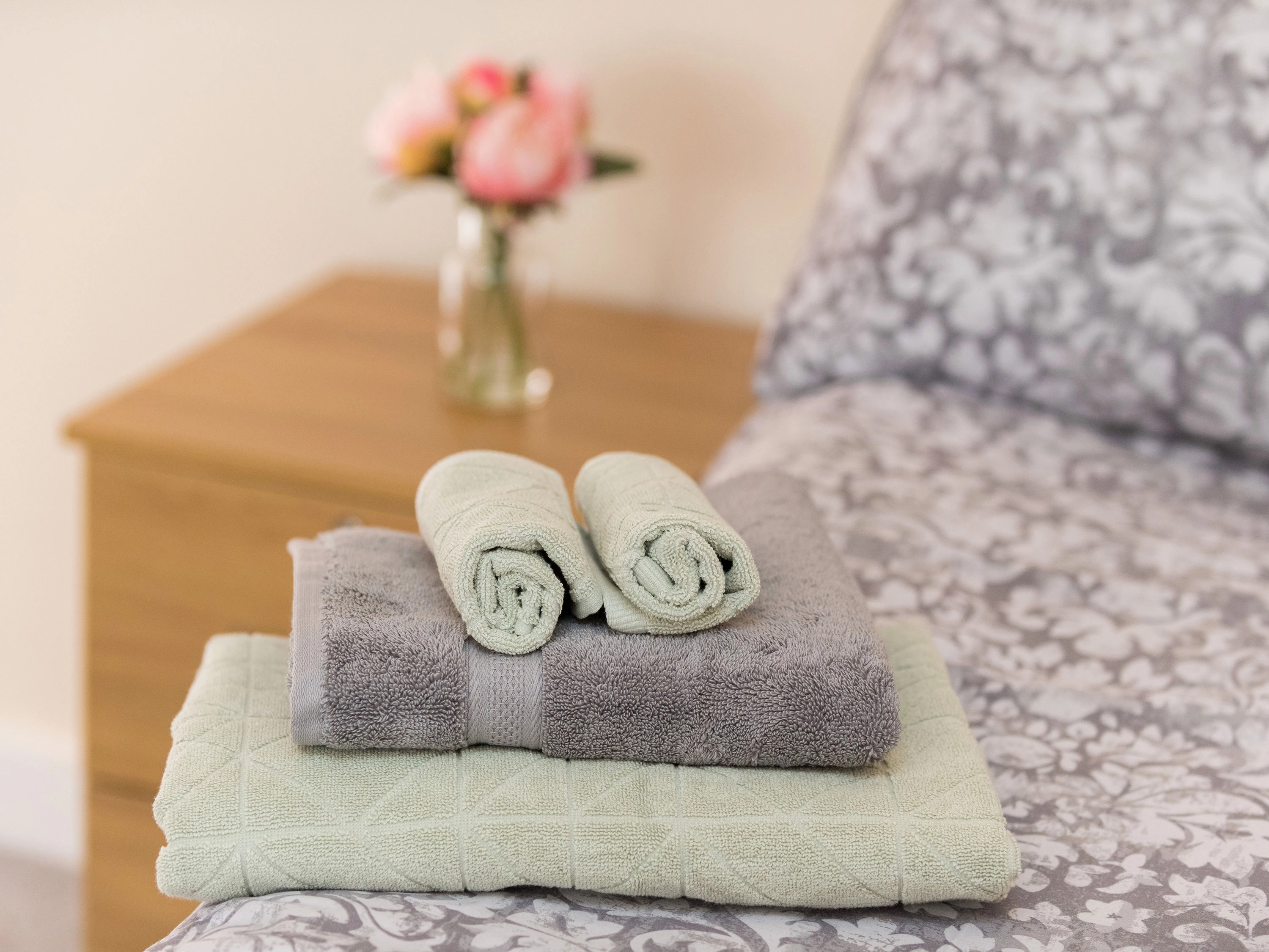 Towels Folded Neatly On Bed