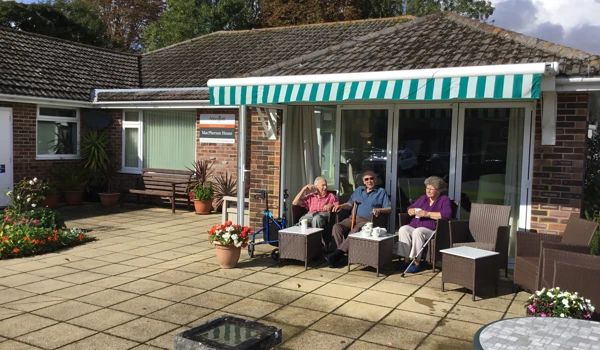 View from our lovely garden MacPherson House with residents sit and relax in the sun