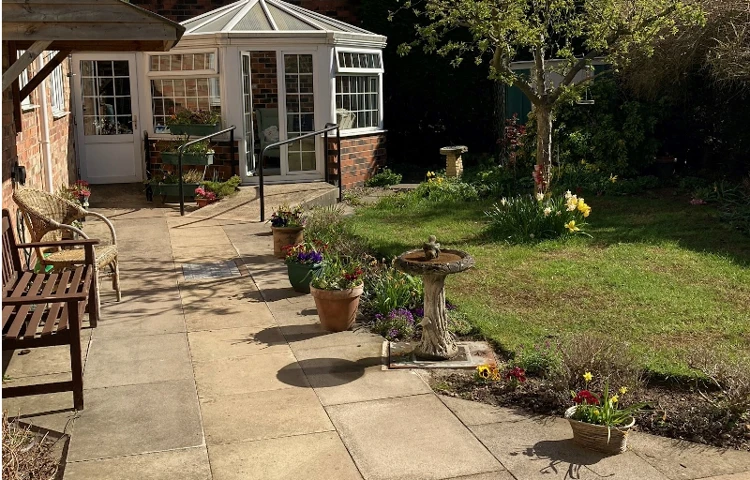 Bright And Sunny Garden With Lovely Patio And Conservatory