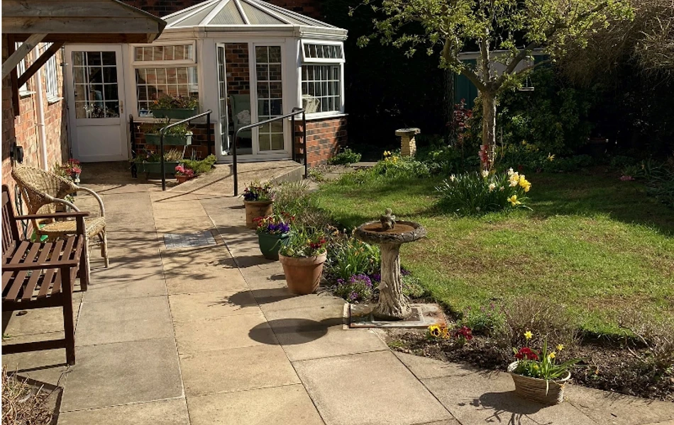 Bright And Sunny Garden With Lovely Patio And Conservatory