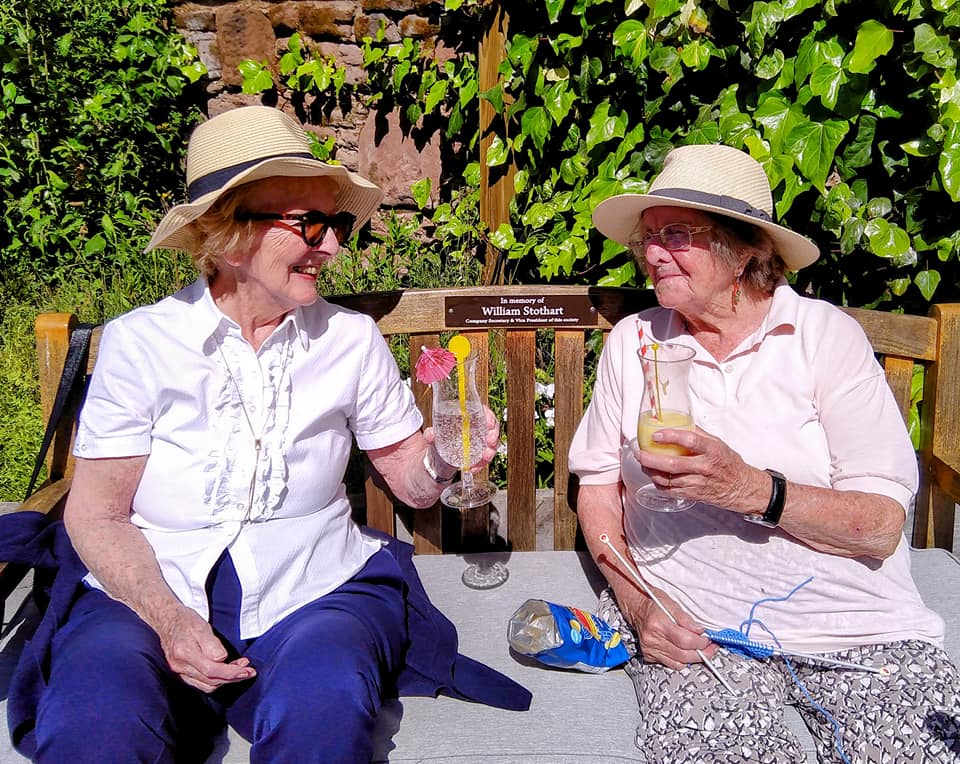 Residents enjoying the sunshine at Lear House, West Kirby CH48 5DT