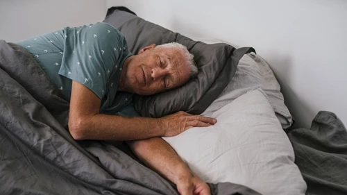 An older man sleeping