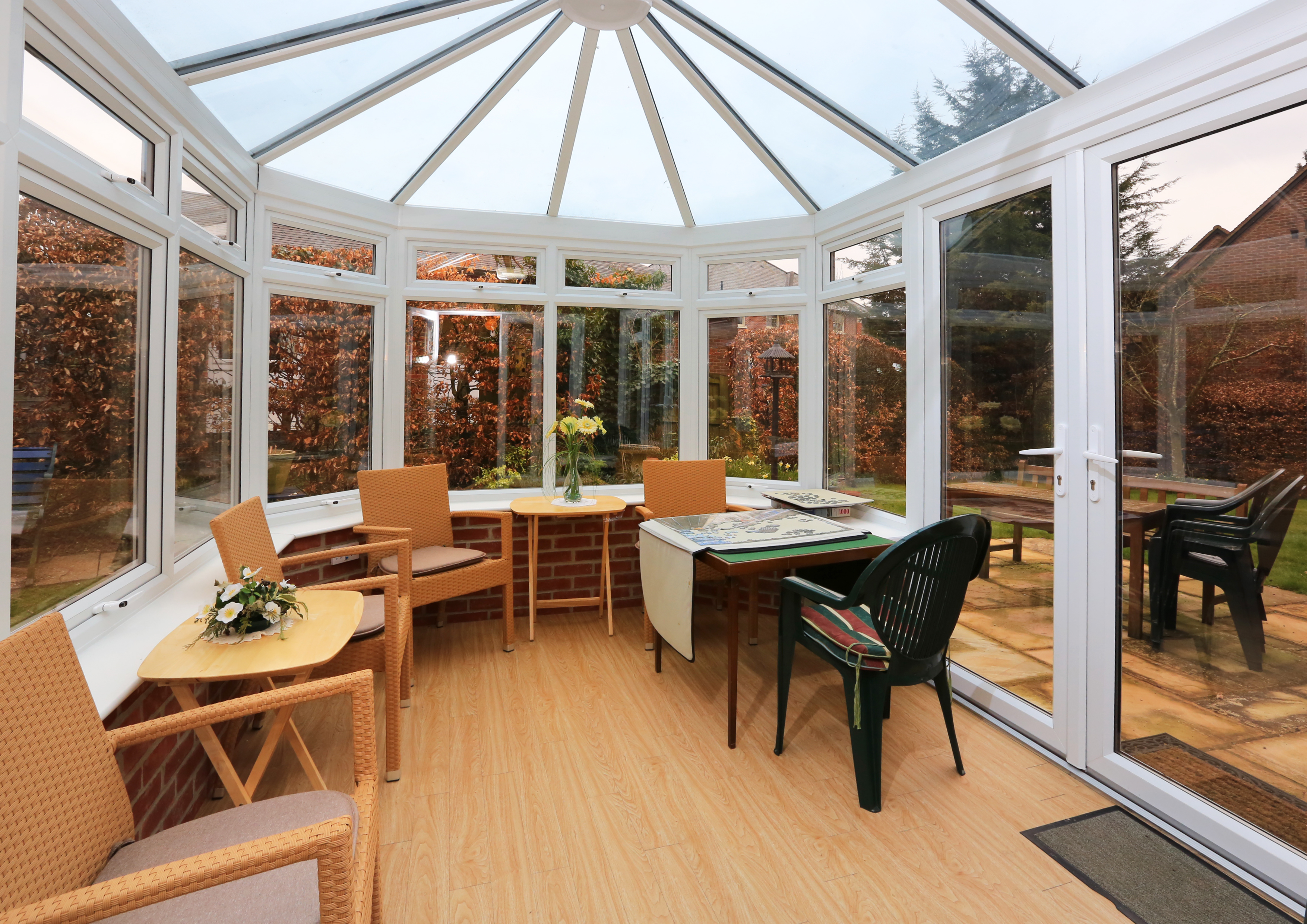 Sit back and relax in our conservatory with view of the garden at Bailey House