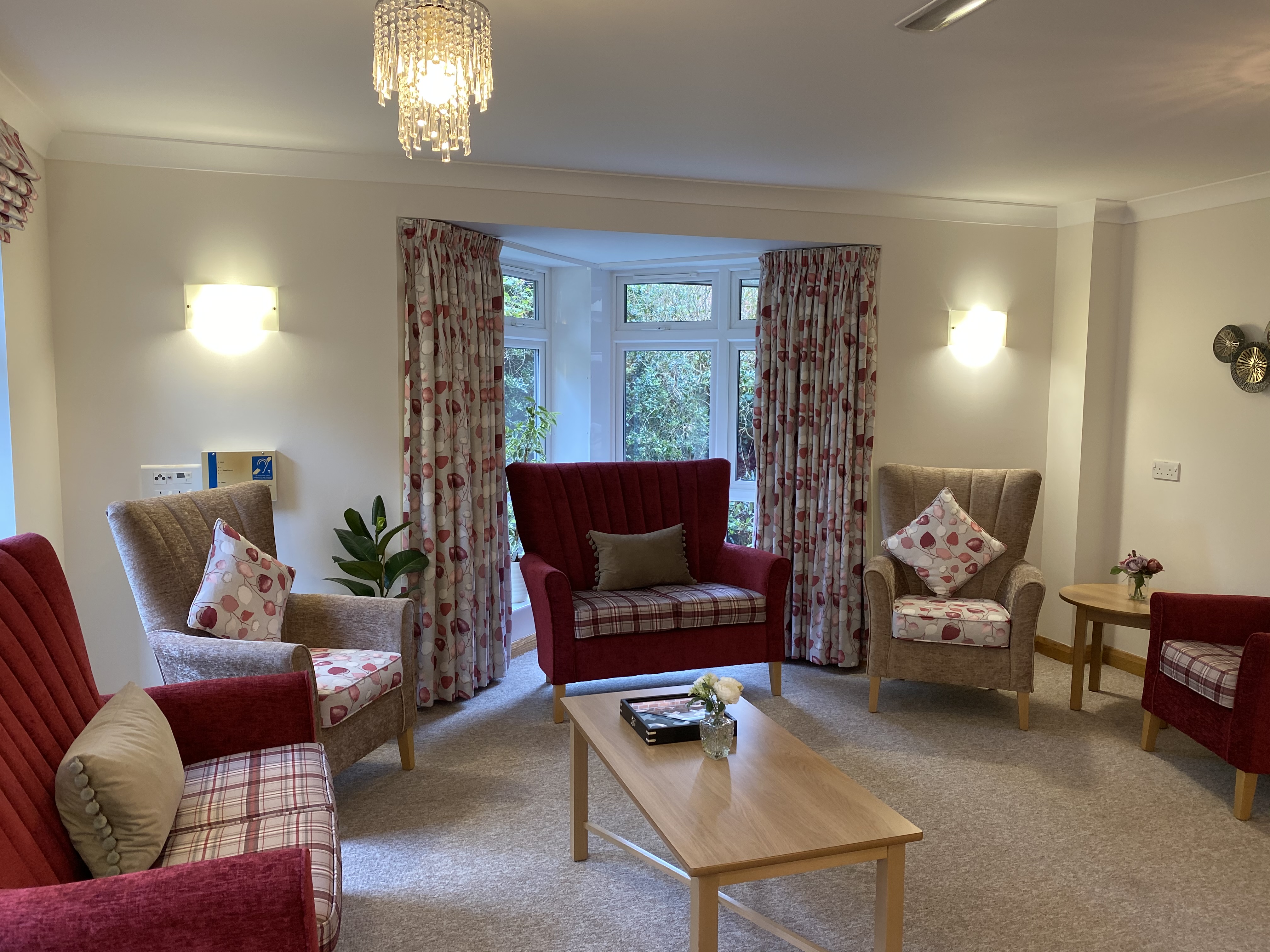 Westbourne House lounge with comfy chairs, table by the window