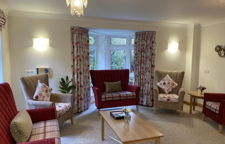 Westbourne House lounge with comfy chairs, table by the window
