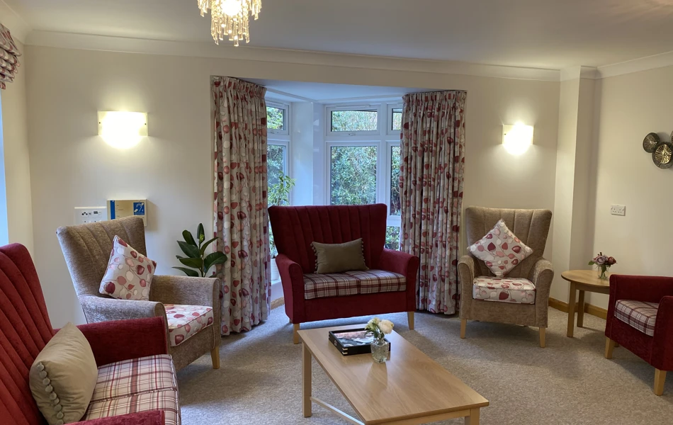 Westbourne House lounge with comfy chairs, table by the window