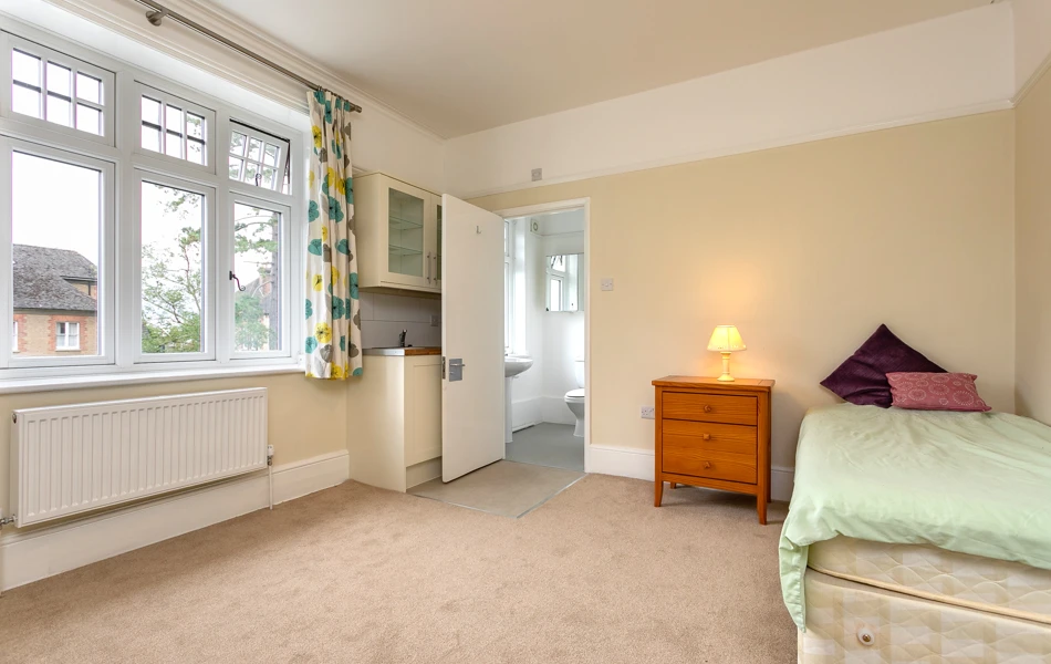 Bed and bathroom in Abbeyfield House, Reigate RH2 9DZ