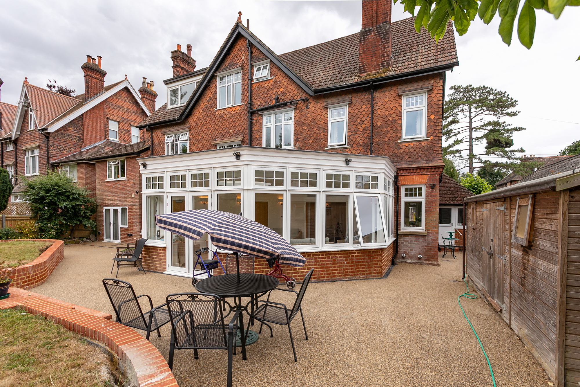 Patio and conservatory at the rear of Abbeyfield House, Reigate RH2 9DZ