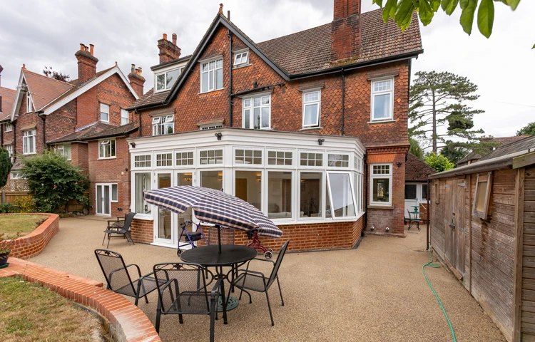 Patio and conservatory at the rear of Abbeyfield House, Reigate RH2 9DZ