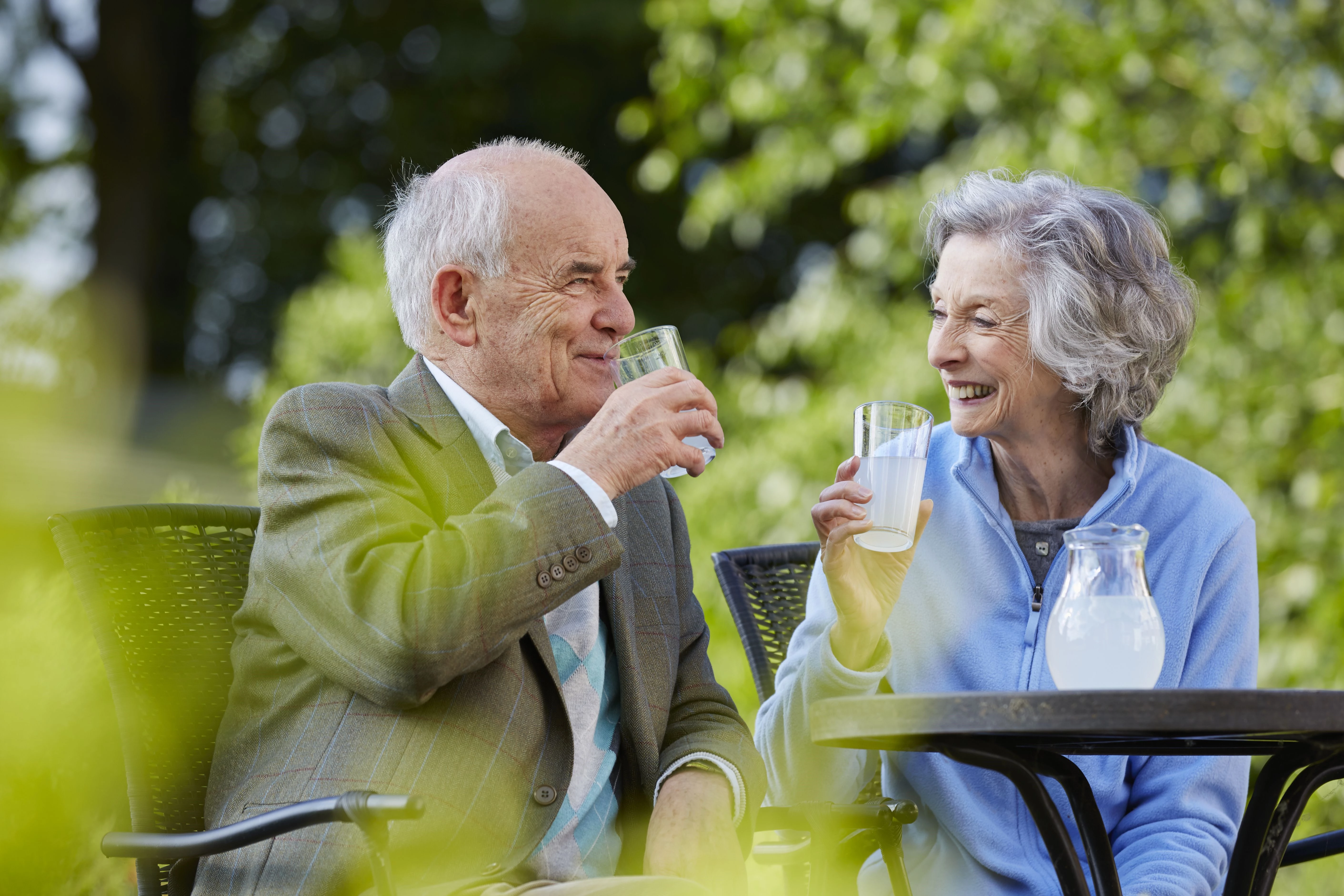 Older Couple Enjoying Drinks Outdoors