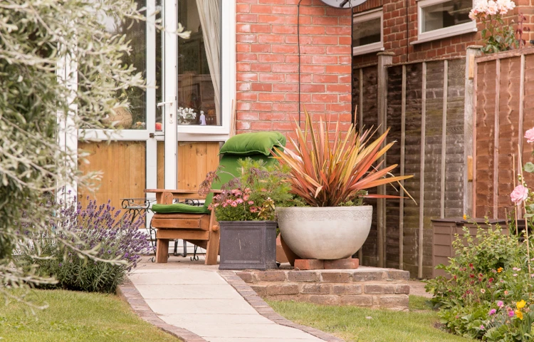 Table and chair on the patio where residents can relax in the fresh air