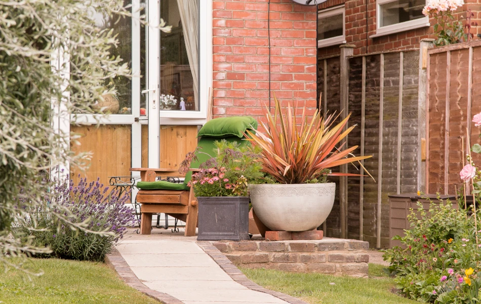 Table and chair on the patio where residents can relax in the fresh air