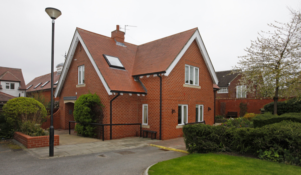 The front of Earl Keelan House with a lamp post outside Earl Keelan House