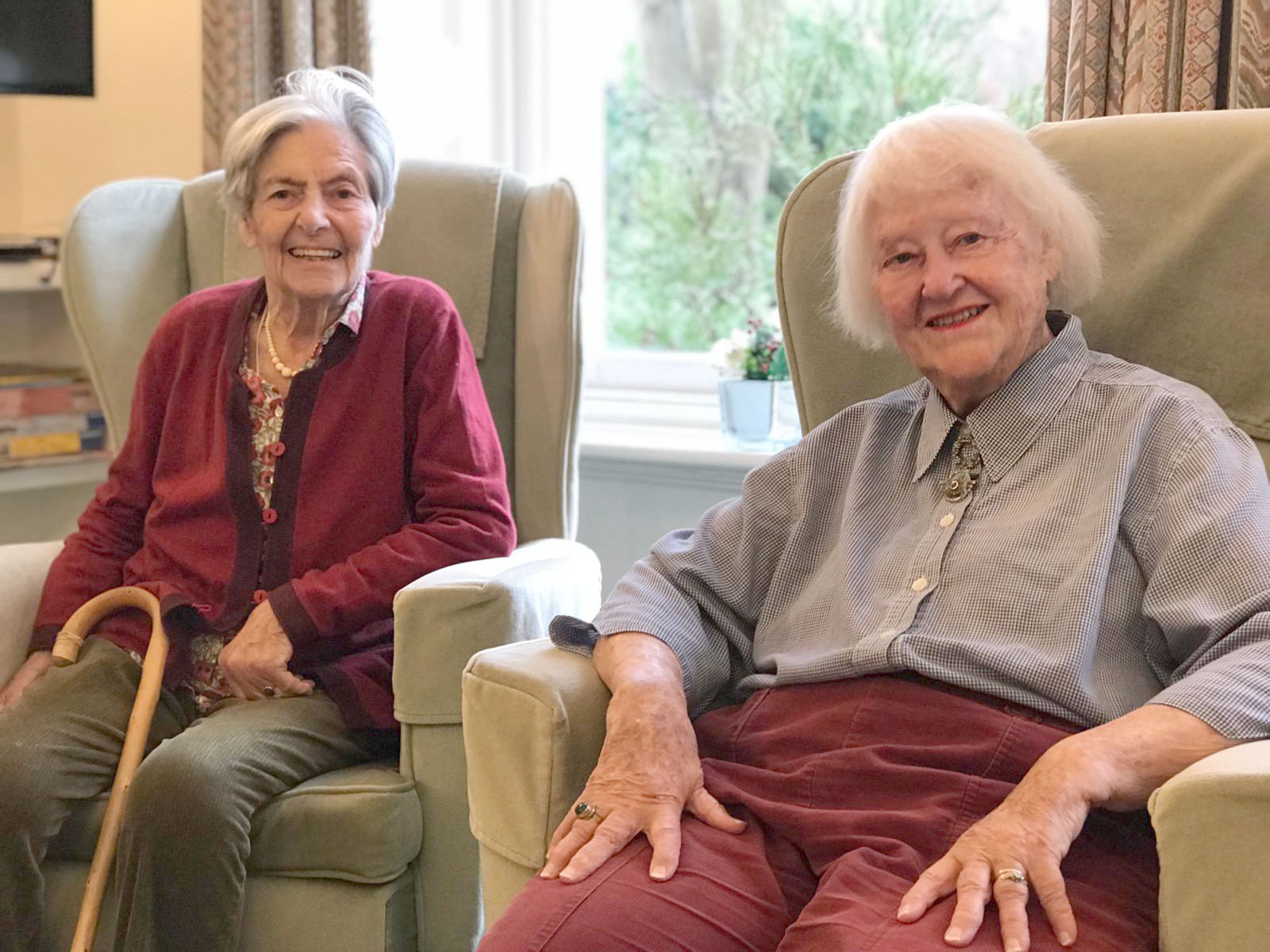 Residents sitting in chairs at Prestbury House, Cheltenham GL52 3DD