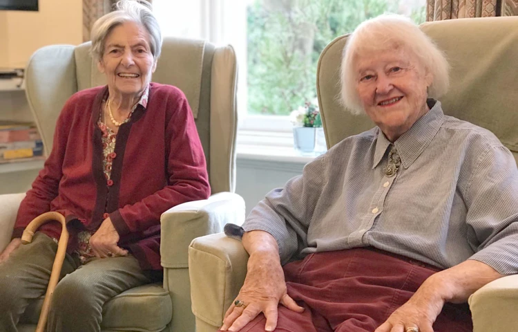 Residents sitting in chairs at Prestbury House, Cheltenham GL52 3DD