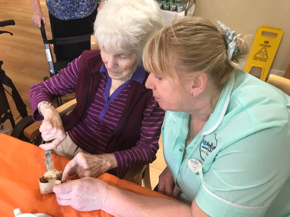 Staff and residents enjoying an afternoon of baking