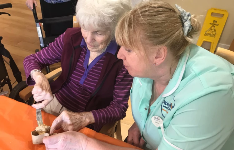 Staff and residents enjoying an afternoon of baking