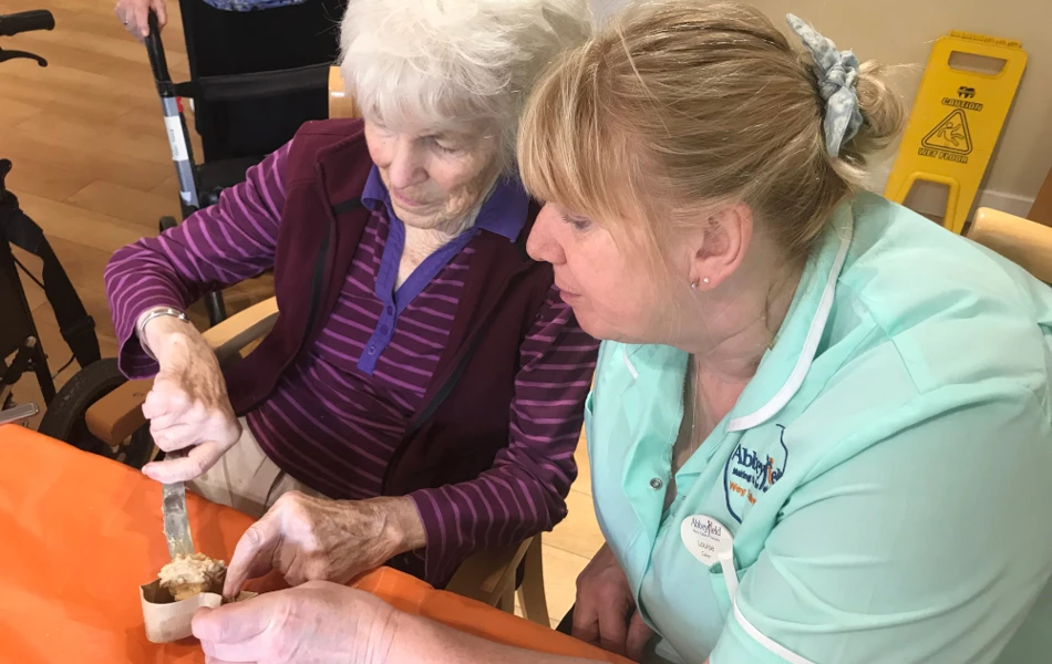 Staff and residents enjoying an afternoon of baking