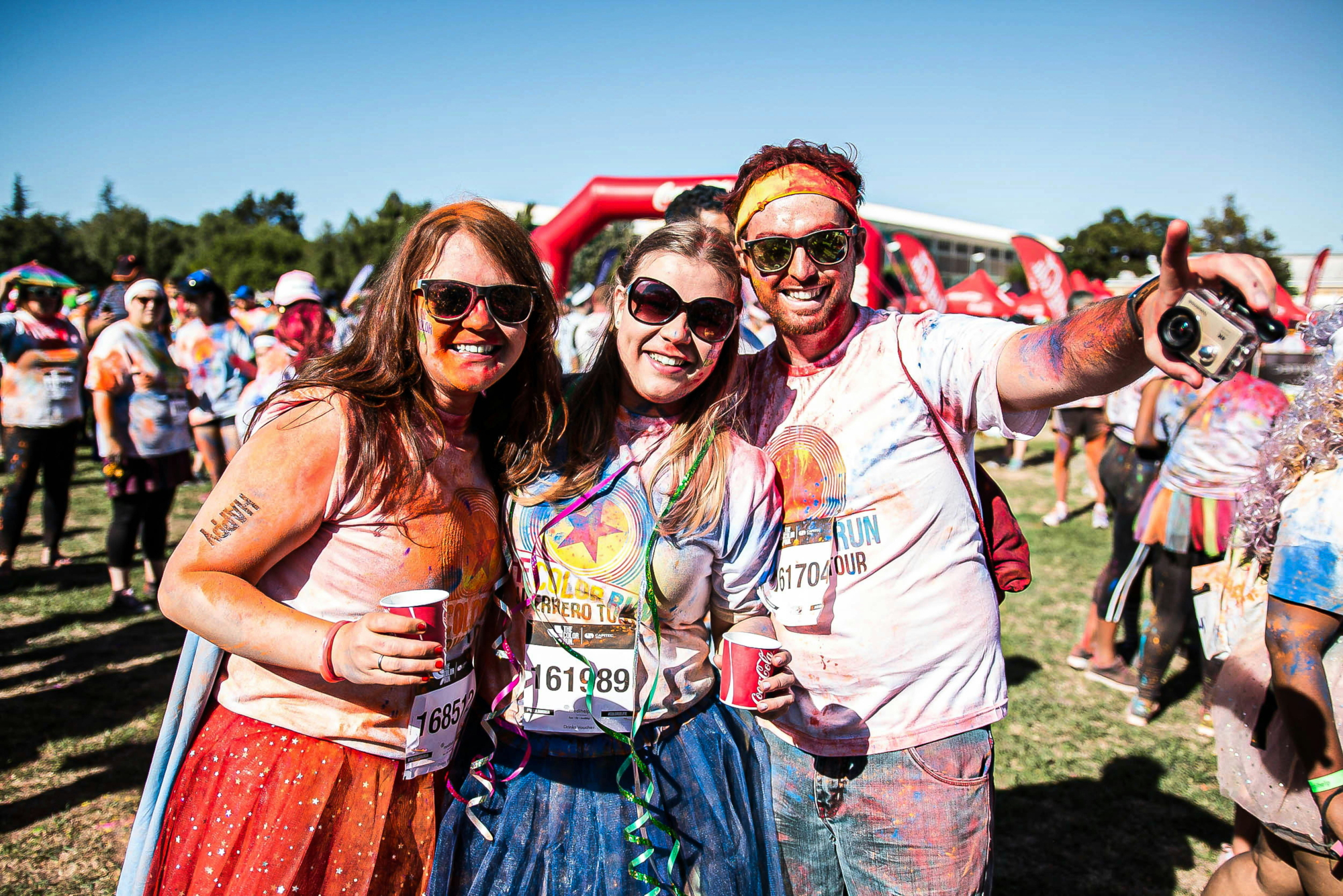 Group Of People Taking Part In A Colour Run