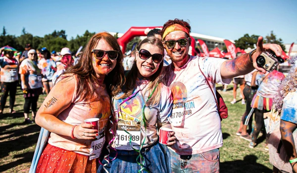 Group Of People Taking Part In A Colour Run