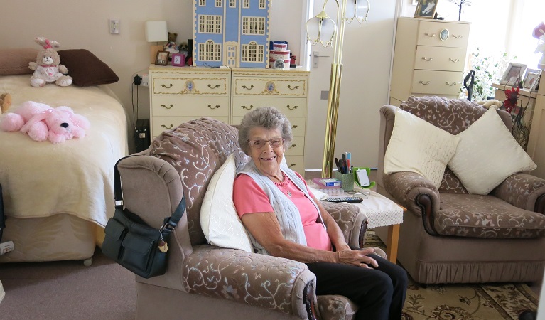 Resident enjoys sitting in her bedroom at Harding House