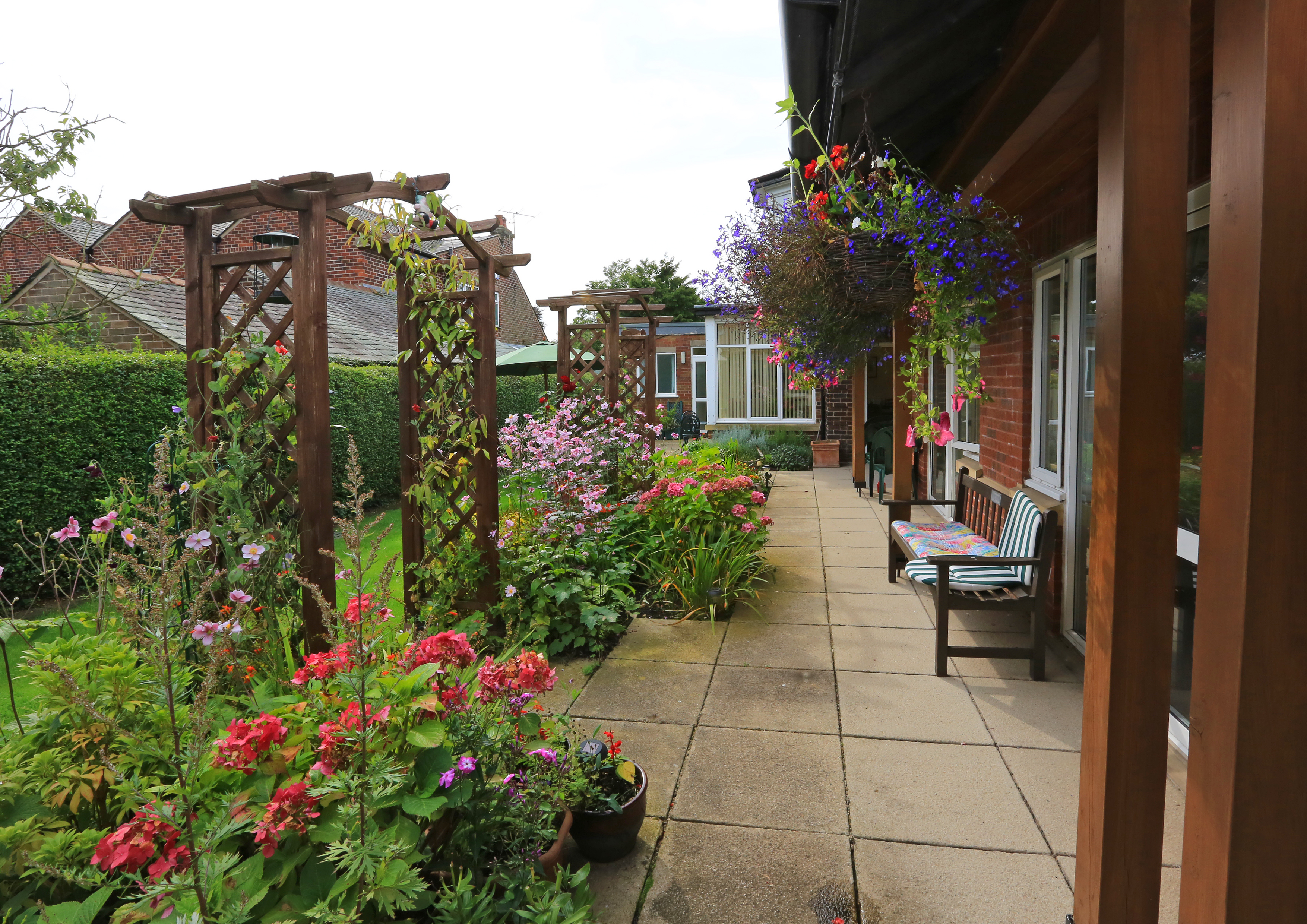 Flowers, plants and hanging baskets with seating areas