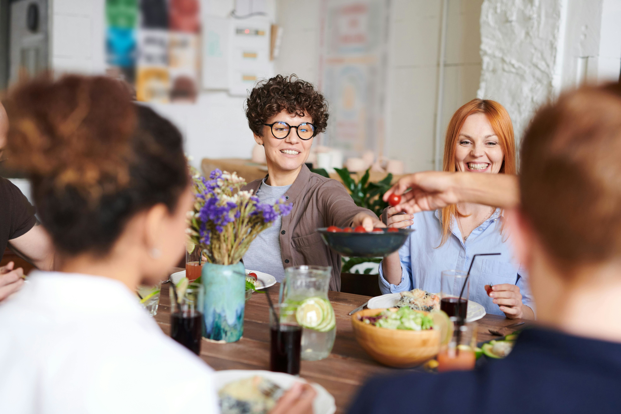 Group Of Happy People Enjoying A Meal Together