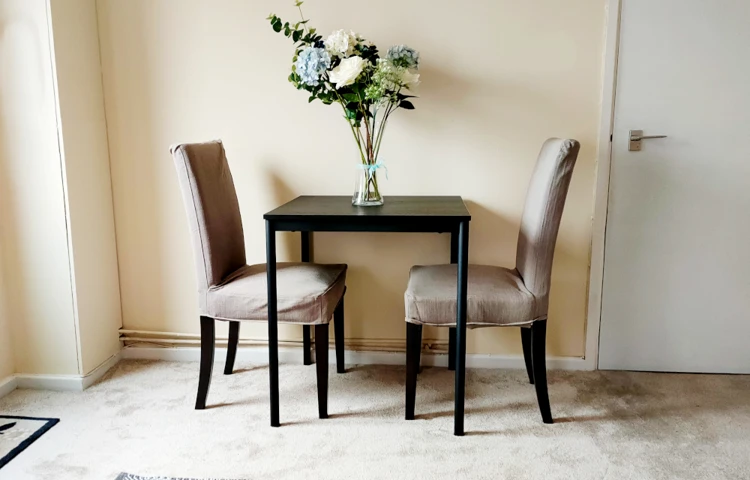 Dining area in spacious lounge area of resident flat at St Mary's House