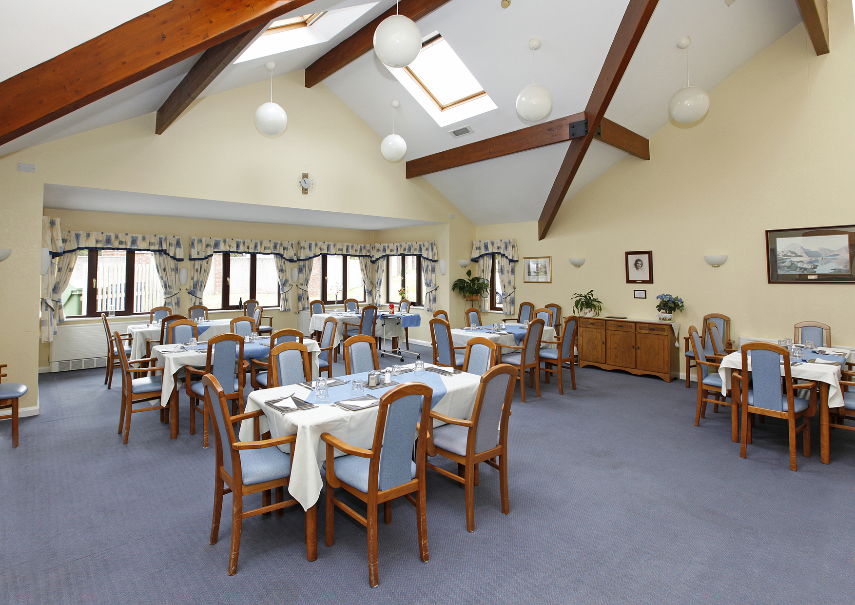 Blue tables and chairs set for dinner
