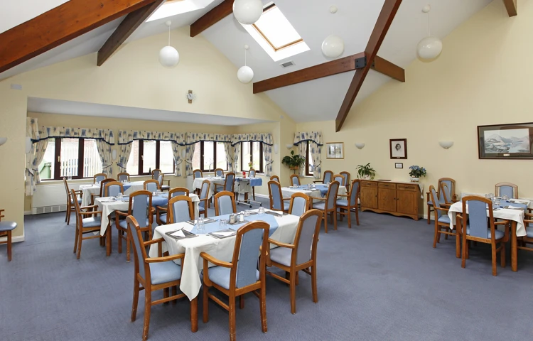 Blue tables and chairs set for dinner