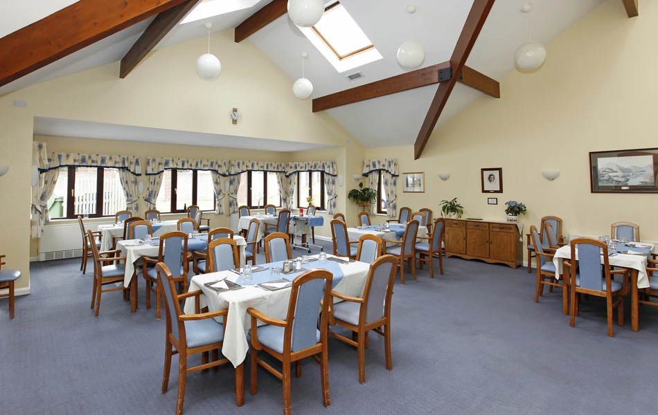 Blue tables and chairs set for dinner